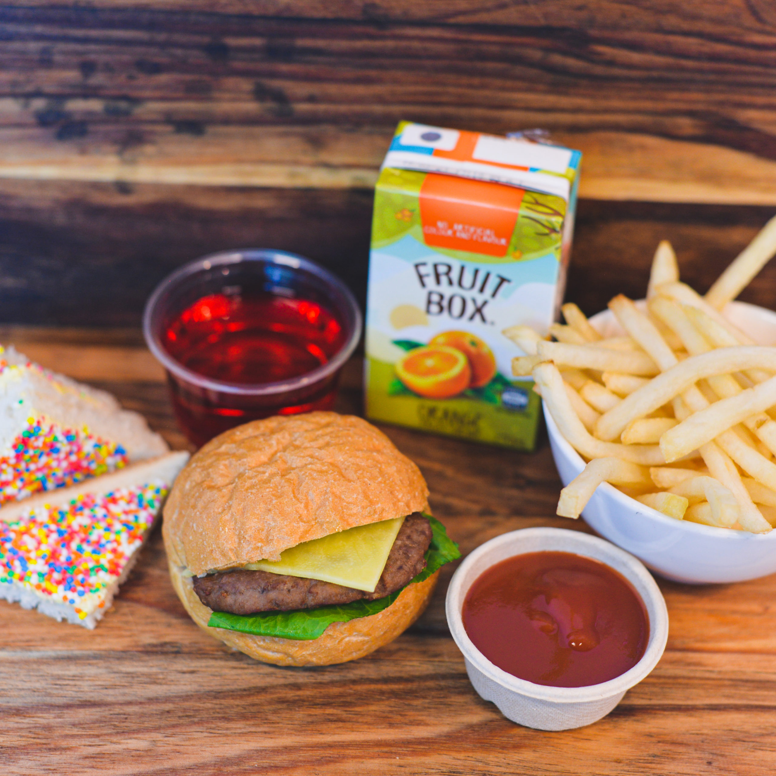 Beef Burger, small French fries, sauce, fairy bread, Jelly and juice box ($38.00)