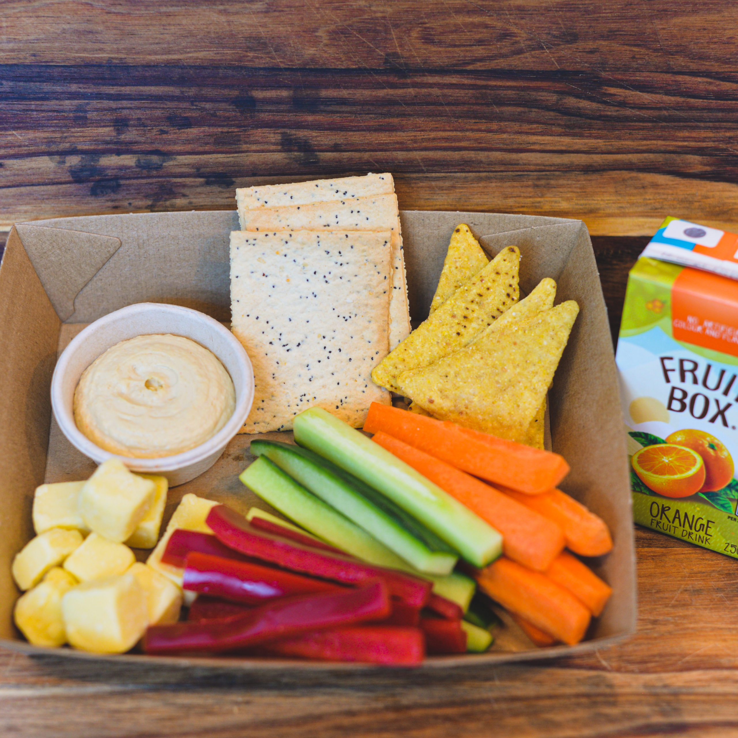 Carrot, Capsicum and Cucumber batons, lavosh, hummus, cheese cubes, corn chips and Juice($38.00)