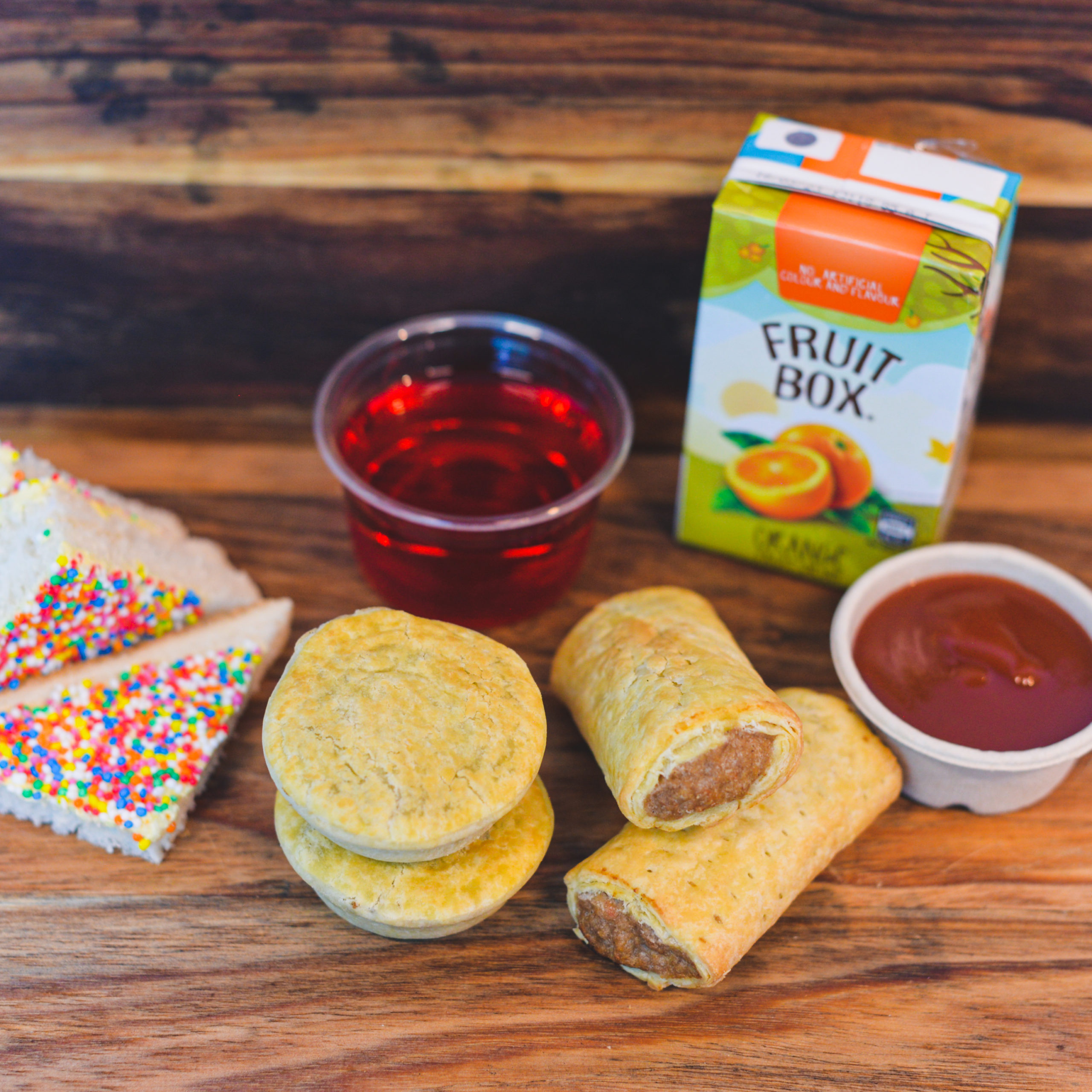 Party Pies, Sausage rolls, sauce, Fairy Bread, Jelly and juice box ($38.00)