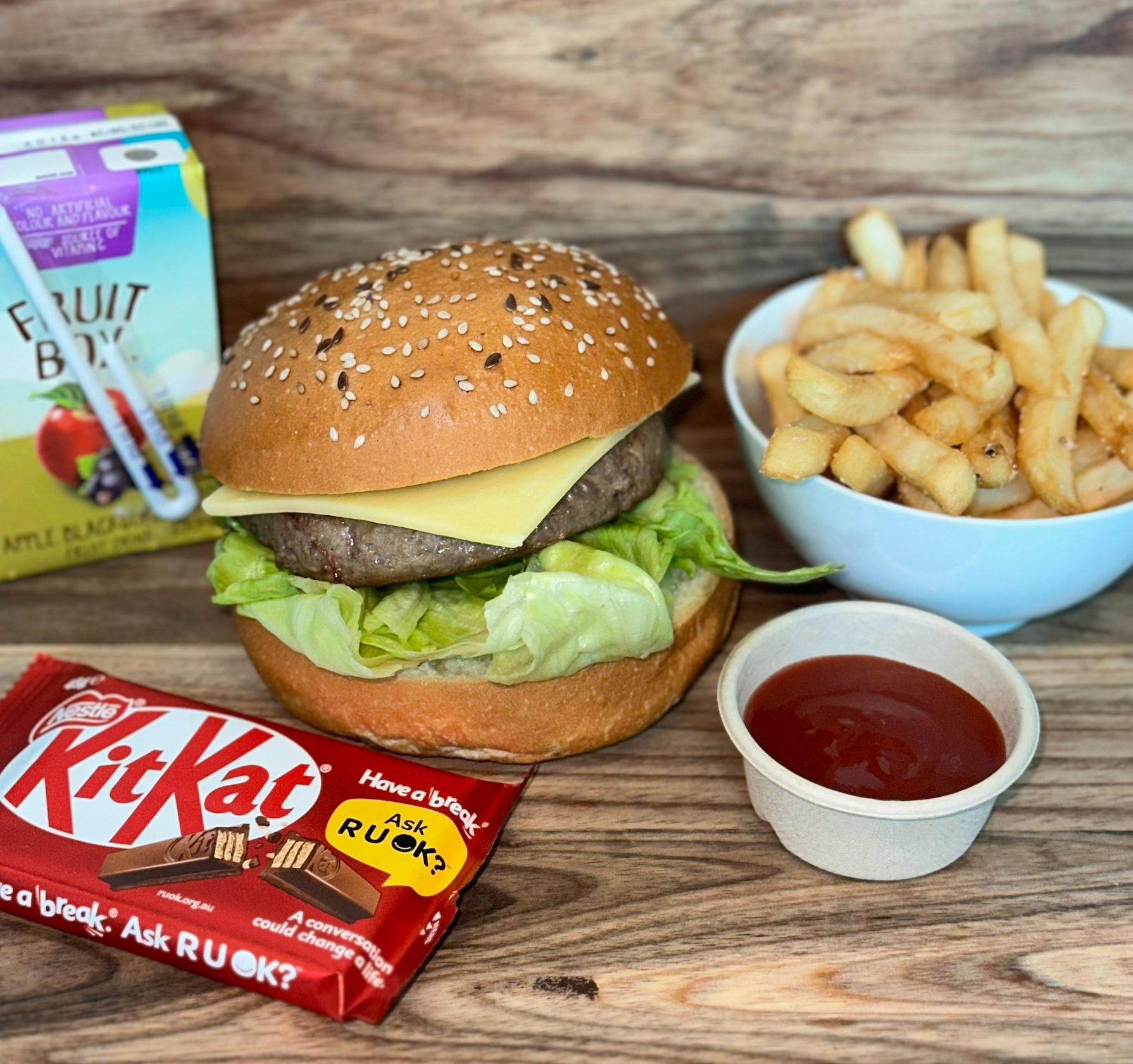 Cheese Burger, Large Fries, Sauce, Chocolate Bar and Juice Box/Soft Drink ($50.00)